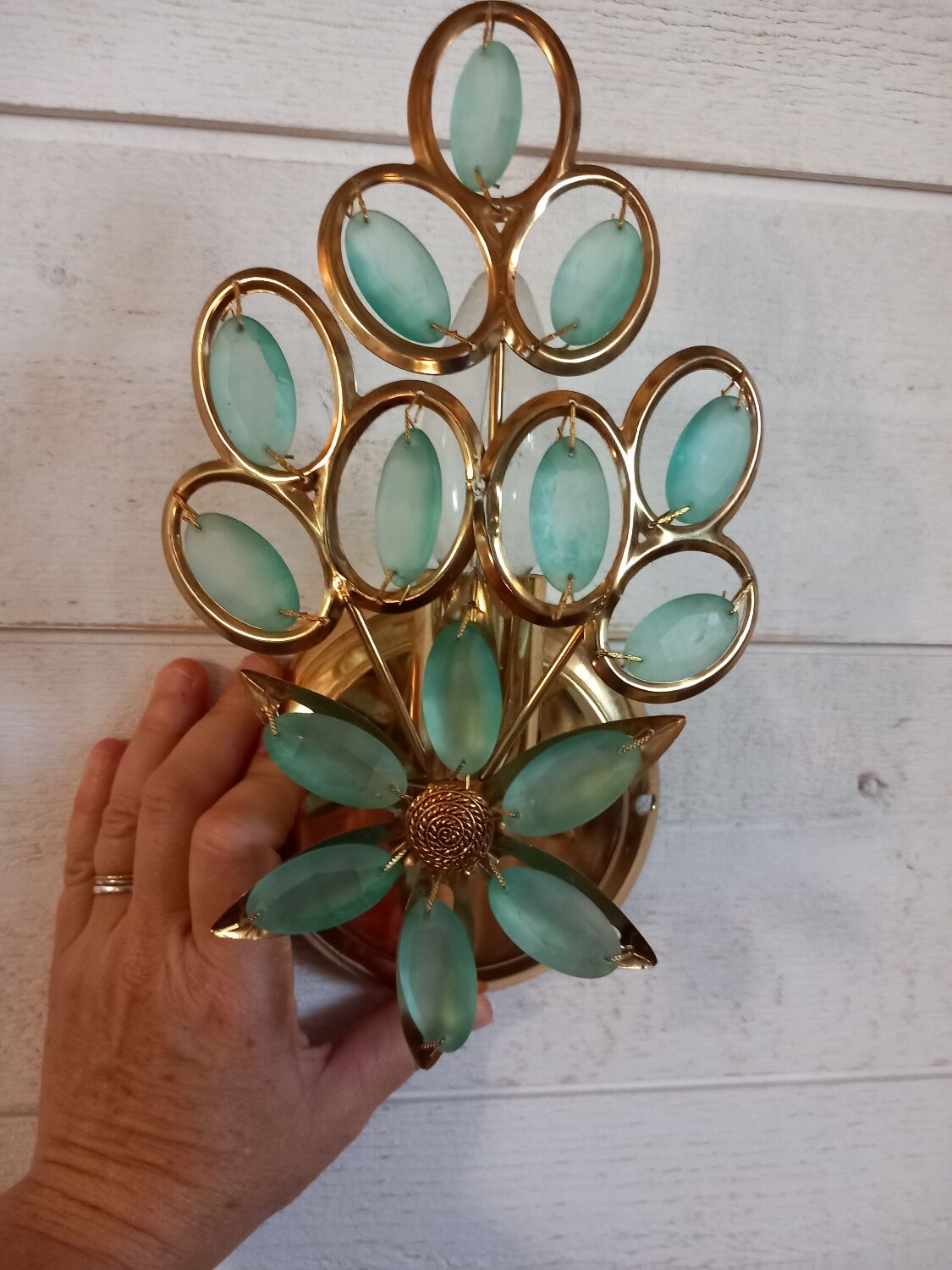 Gold metal wall light with light blue tassels