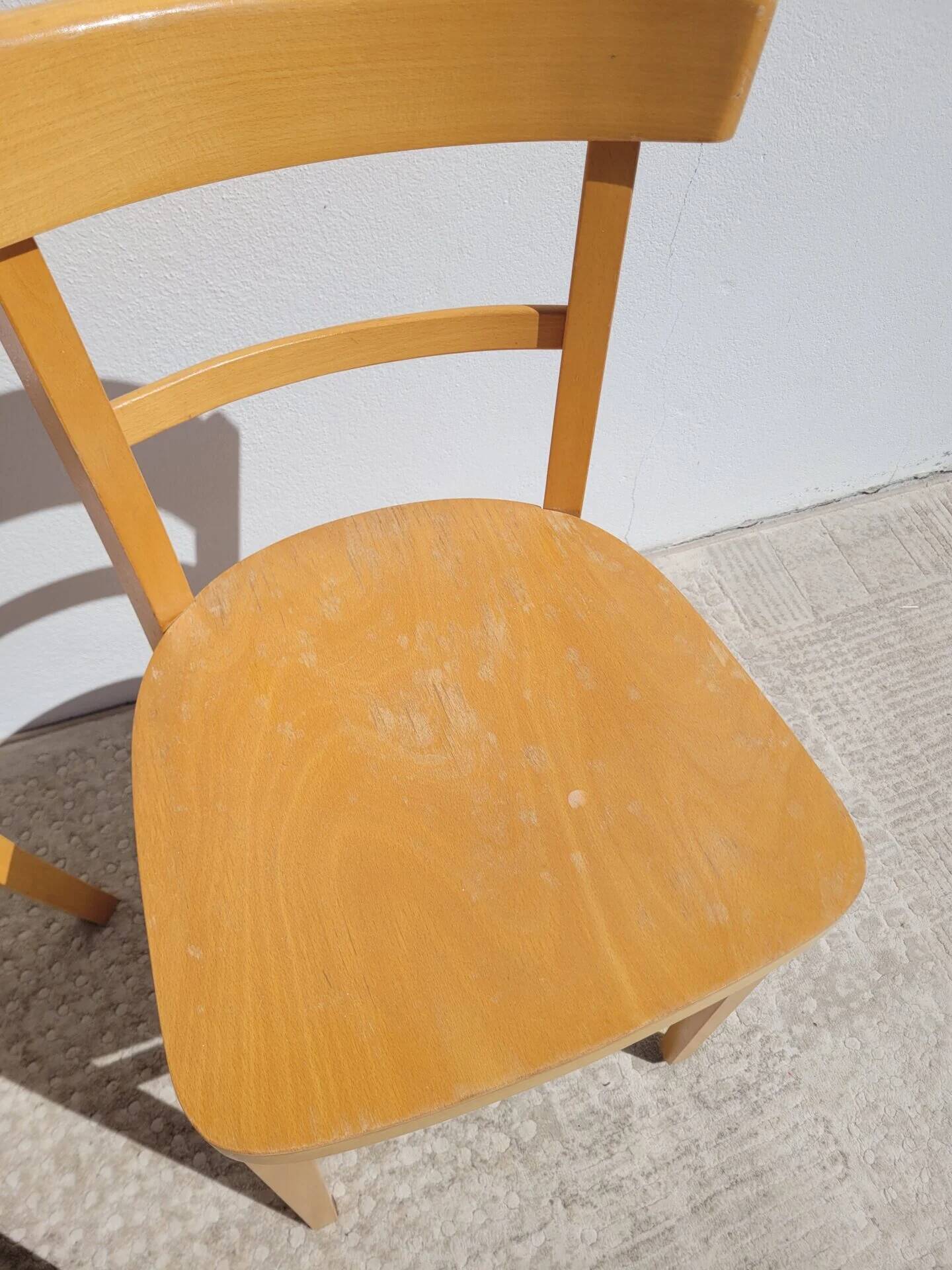 Pair of bistro chairs in light beech.