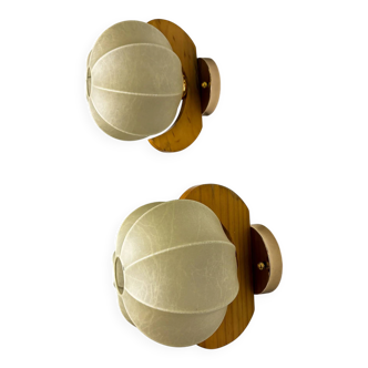 Pair of "Cocoon" wall lights in resin and pine, Italy, circa 1970