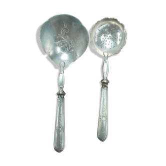Sprinkler and strawberry spoon stuffed silver and silver metal