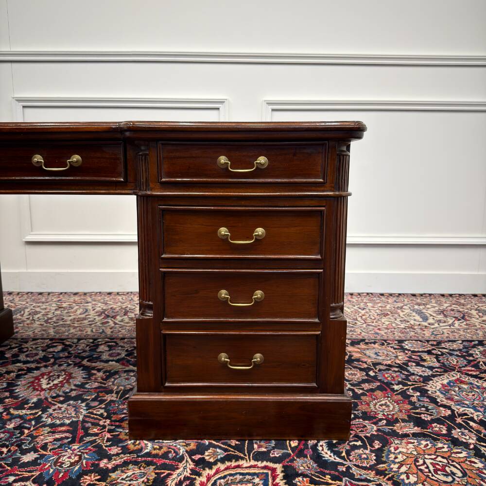Classic English desk with green leather inlay.