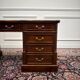 Classic English desk with green leather inlay.