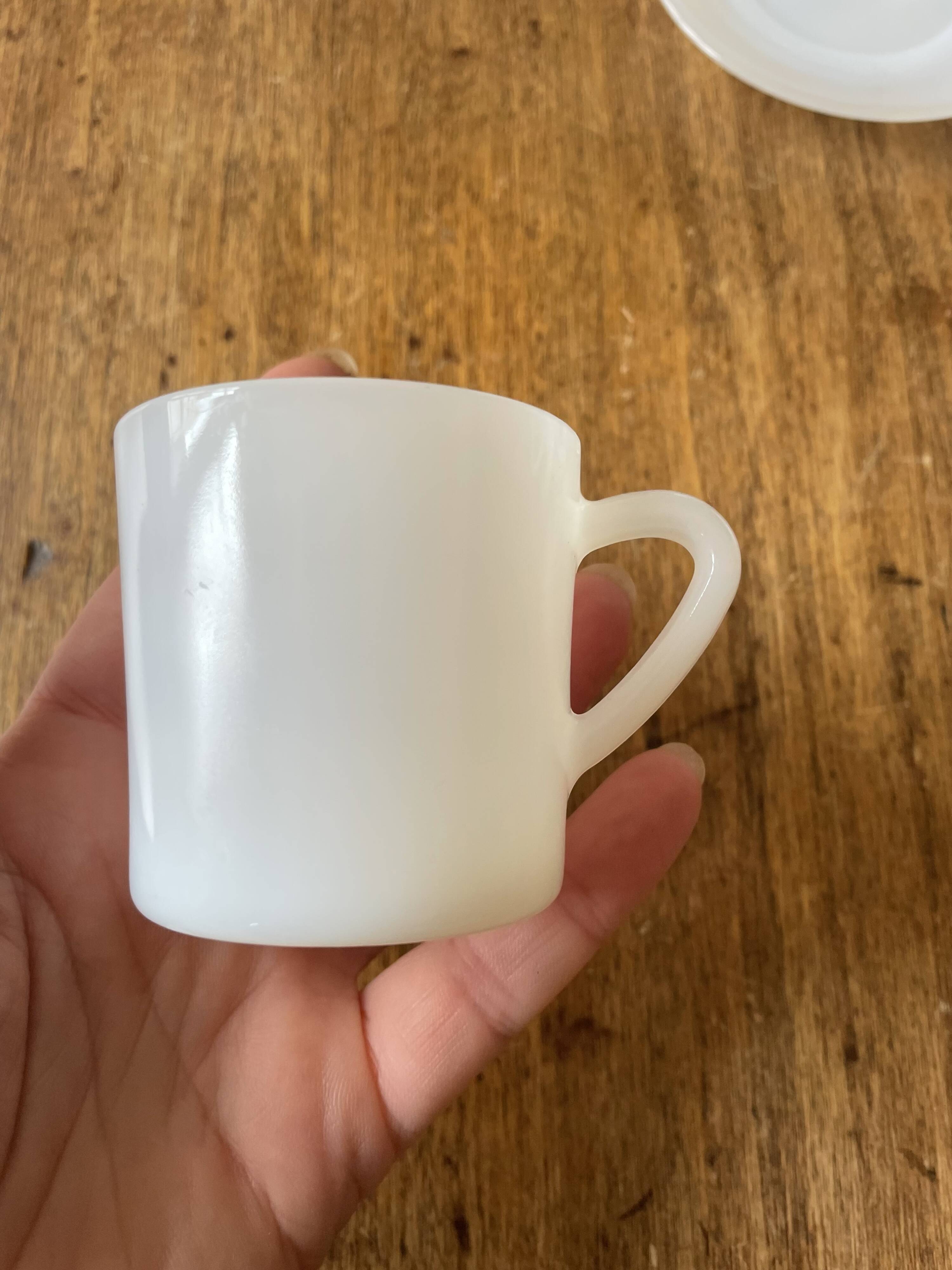 Espresso coffee cup service, Nestlé promotional items, in white glass.