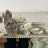 Large antique beveled mirror in carved wood painted with floral decoration and