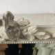 Large antique beveled mirror in carved wood painted with floral decoration and