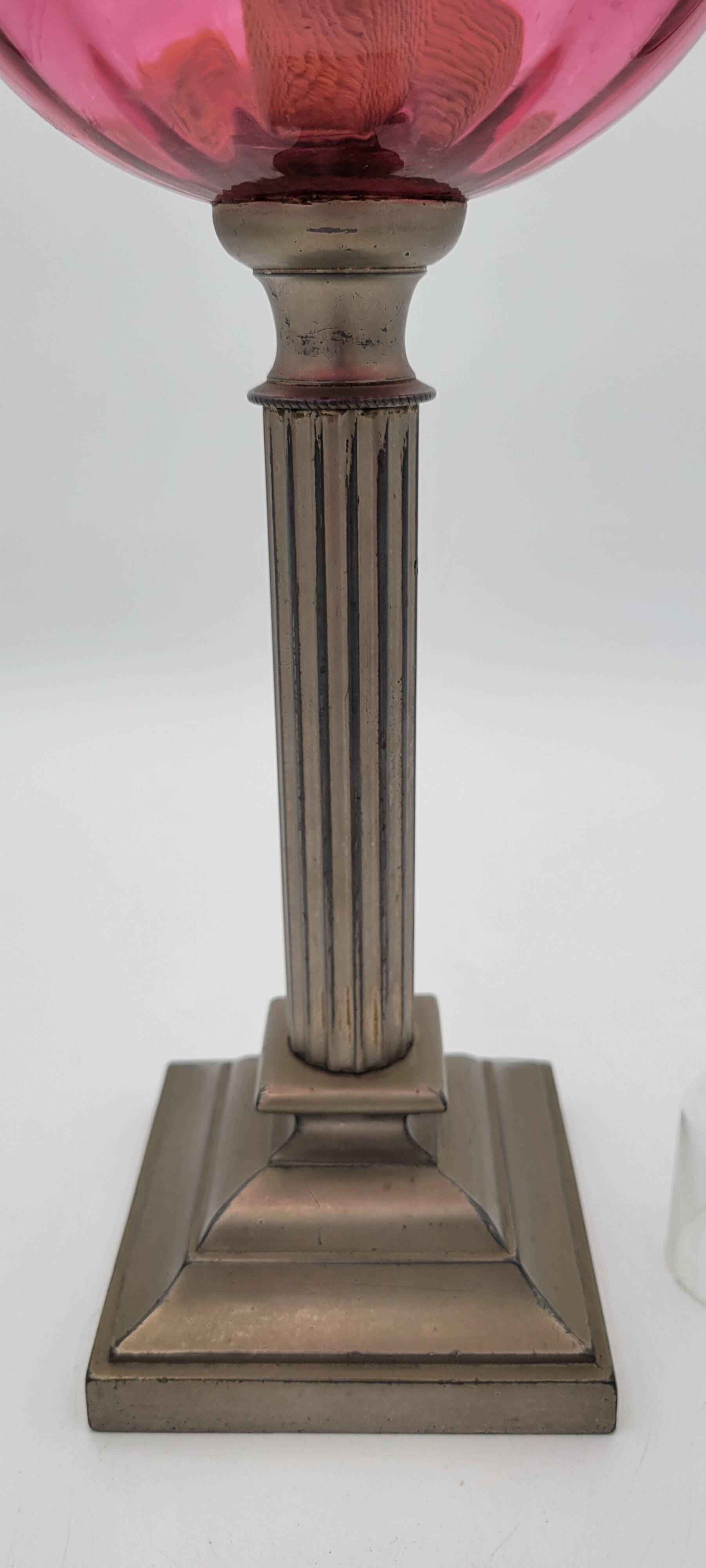 Old metal and pink glass oil lamp