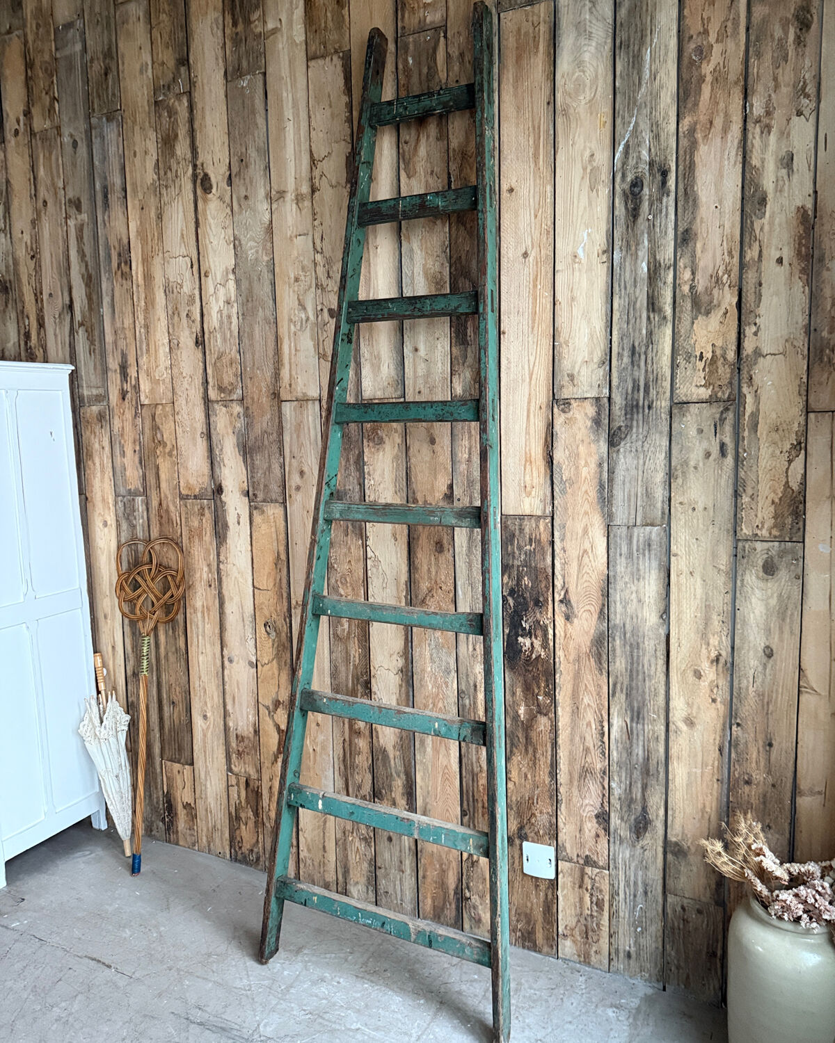 Antique ladder with green patina