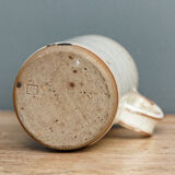 Enamelled sandstone milk jar, signed