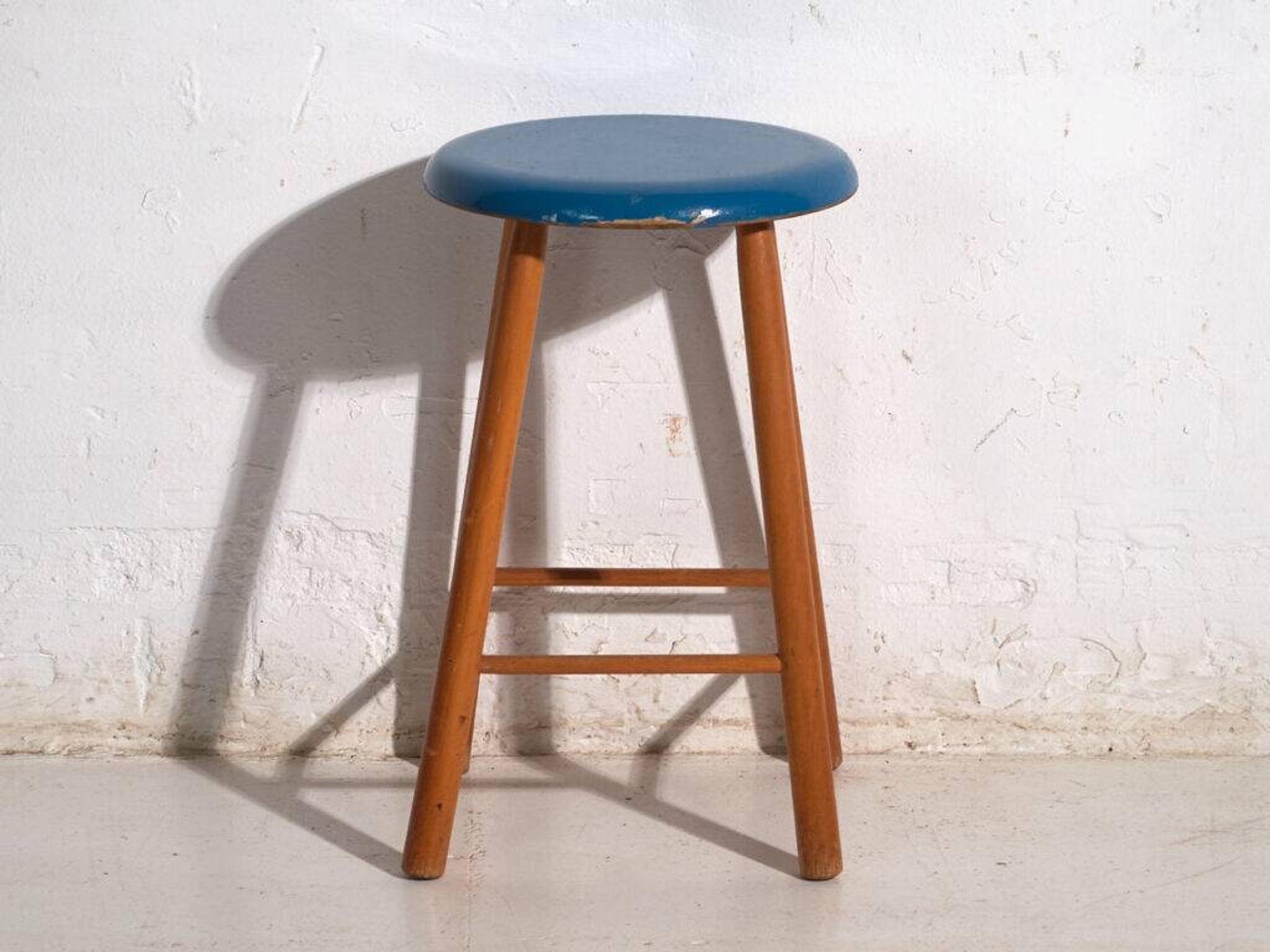 Antique wooden stool with a round seat – Central Europe, around 1950