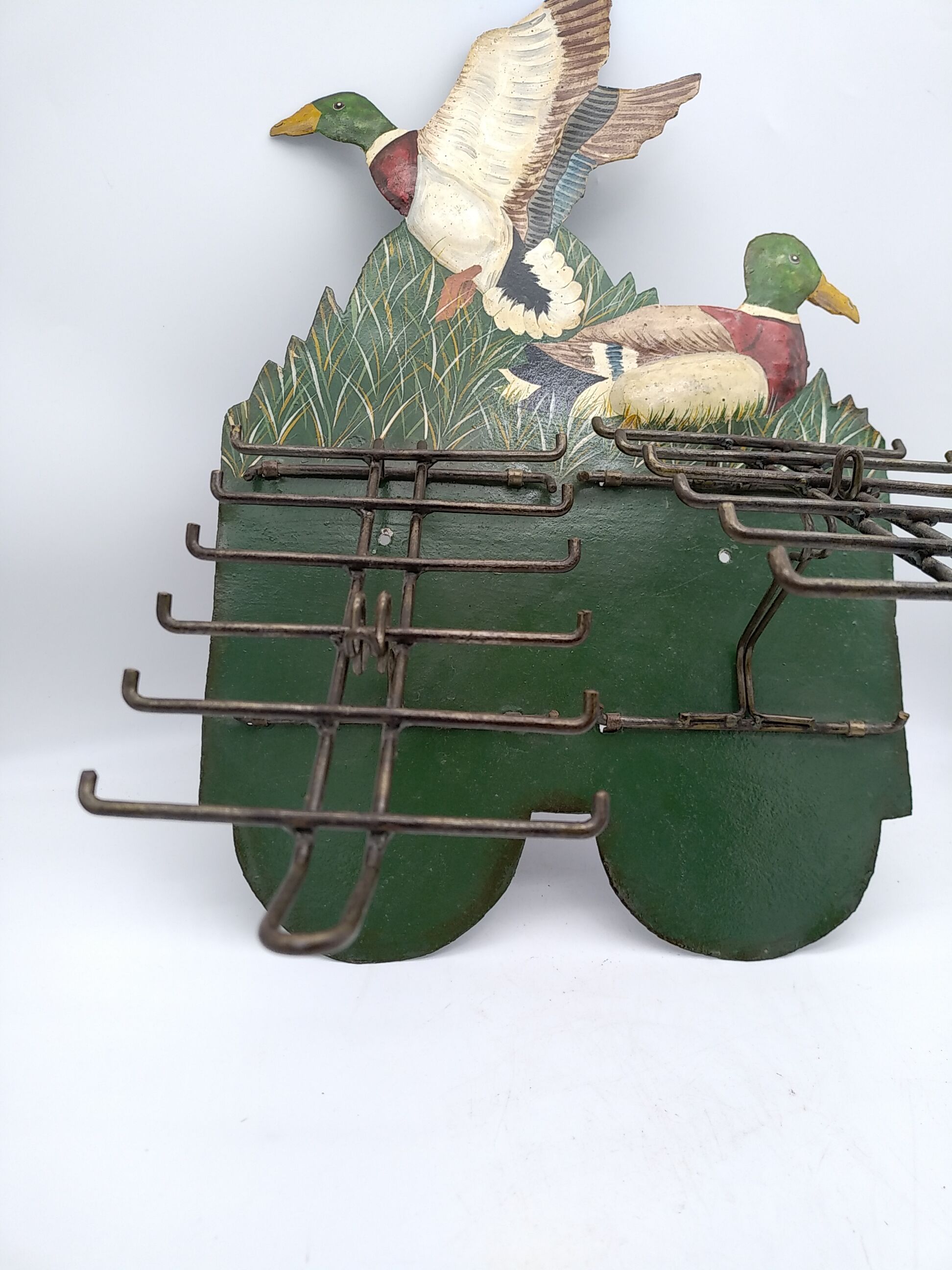 Metal wall tie door with duck decoration. 50s .