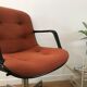 Vintage orange armchair model 451 with wheels by Steelcase Strafor, design by Randall Buck