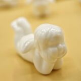 12 porte-couteaux vintage en porcelaine figurant des chérubins