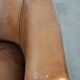 Club chair made of sheepskin leather finished with decorative nails