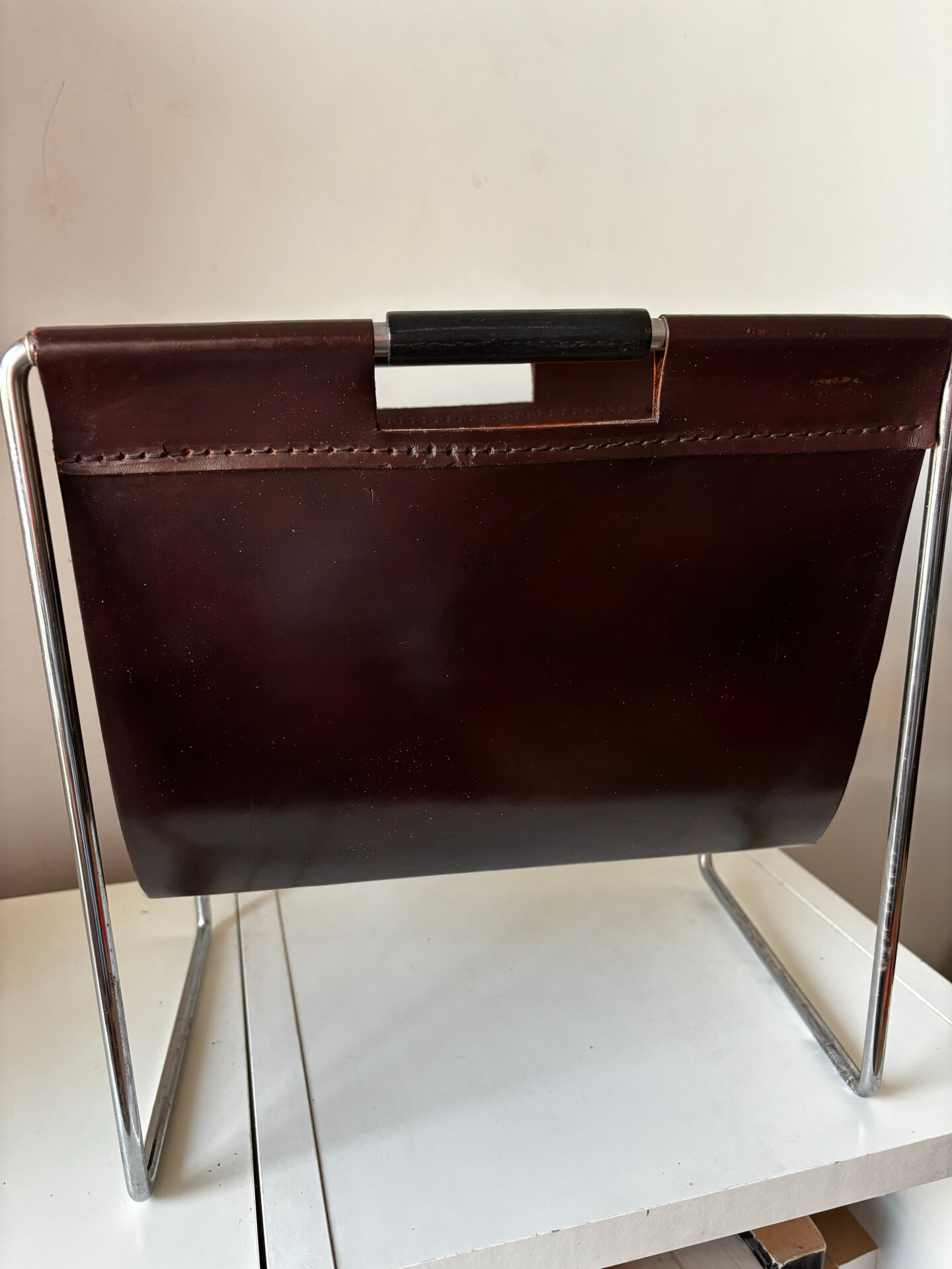 Leather and chrome magazine rack Brabantia