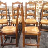 Set of 6 oak dining chairs with high backs and straw seats
