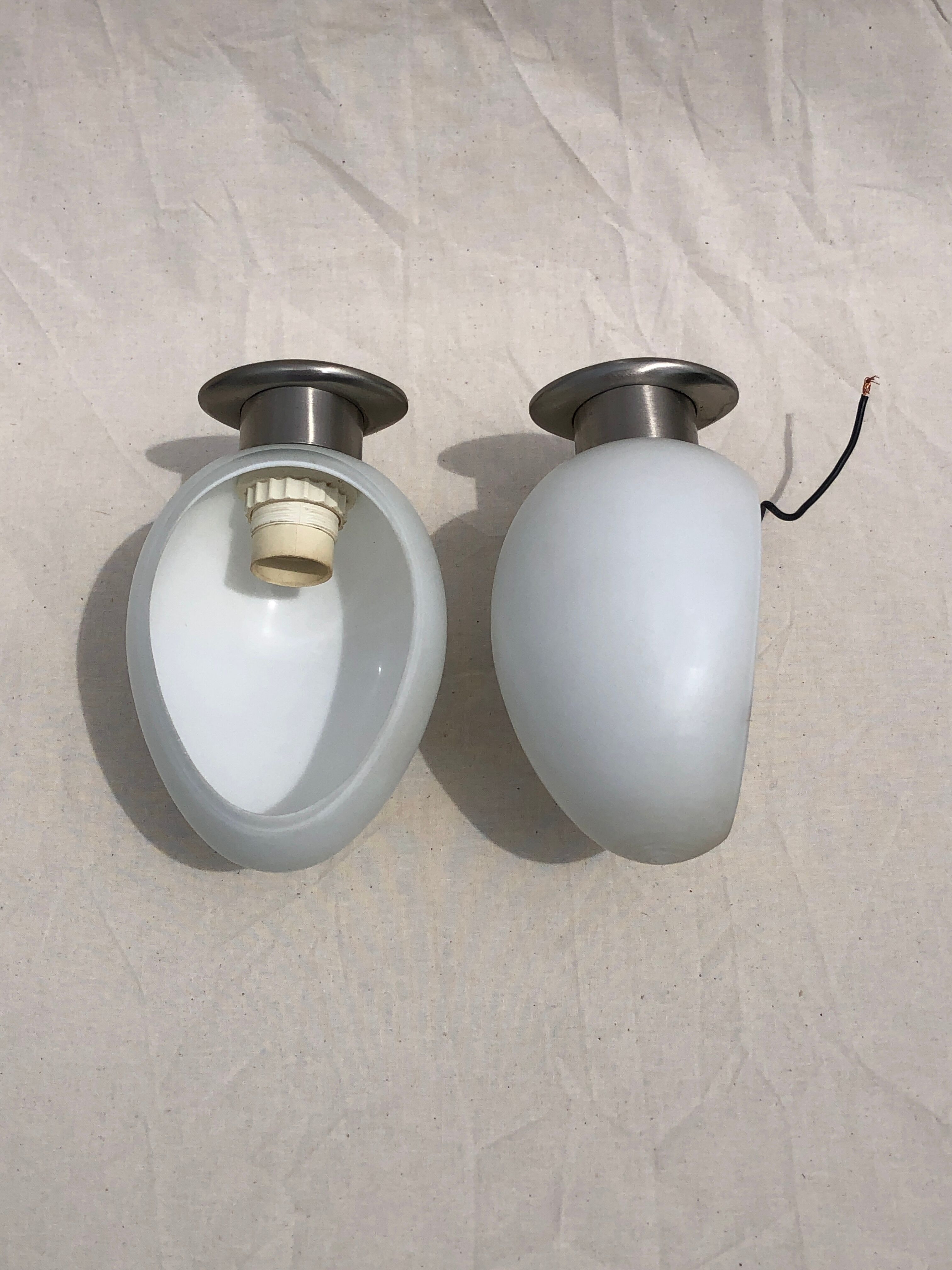 Pair of brushed steel appliques, half-egg opaline, 1970