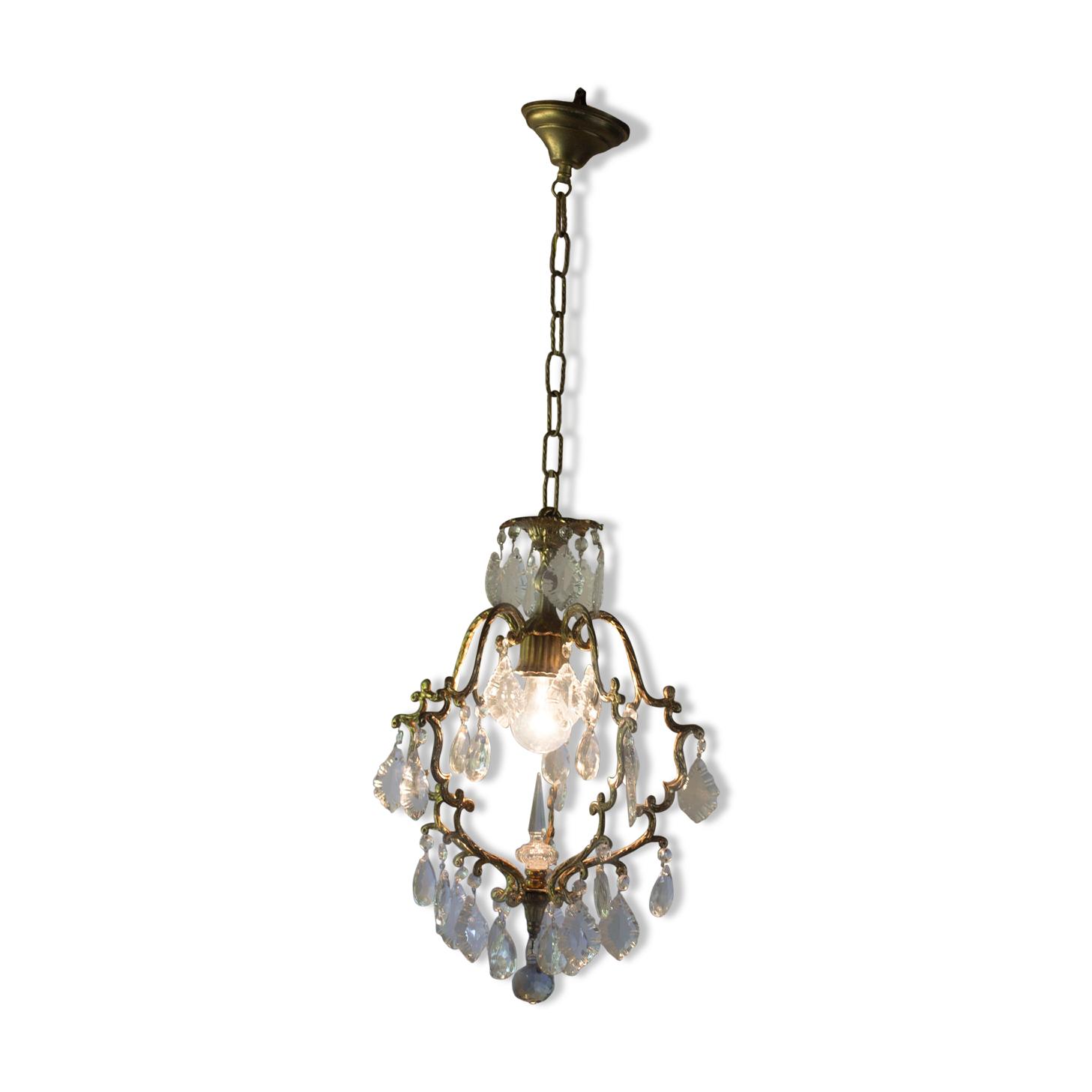 Old brass chandelier with glass stamps