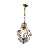 Old brass chandelier with glass stamps