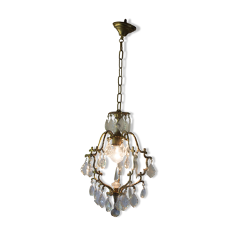 Old brass chandelier with glass stamps