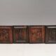 Four old wooden carvings to hang on the wall.