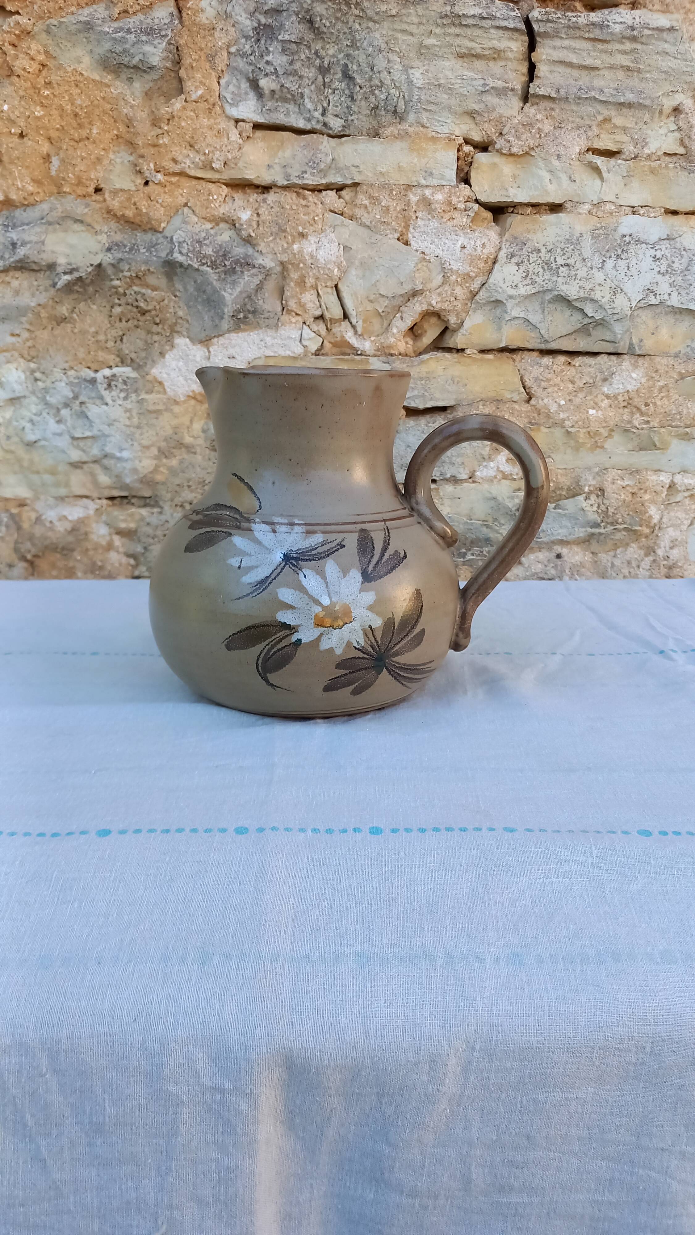 Pitcher in flowery sandstone