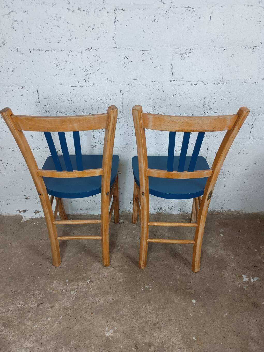 Two refurbished bistro chairs