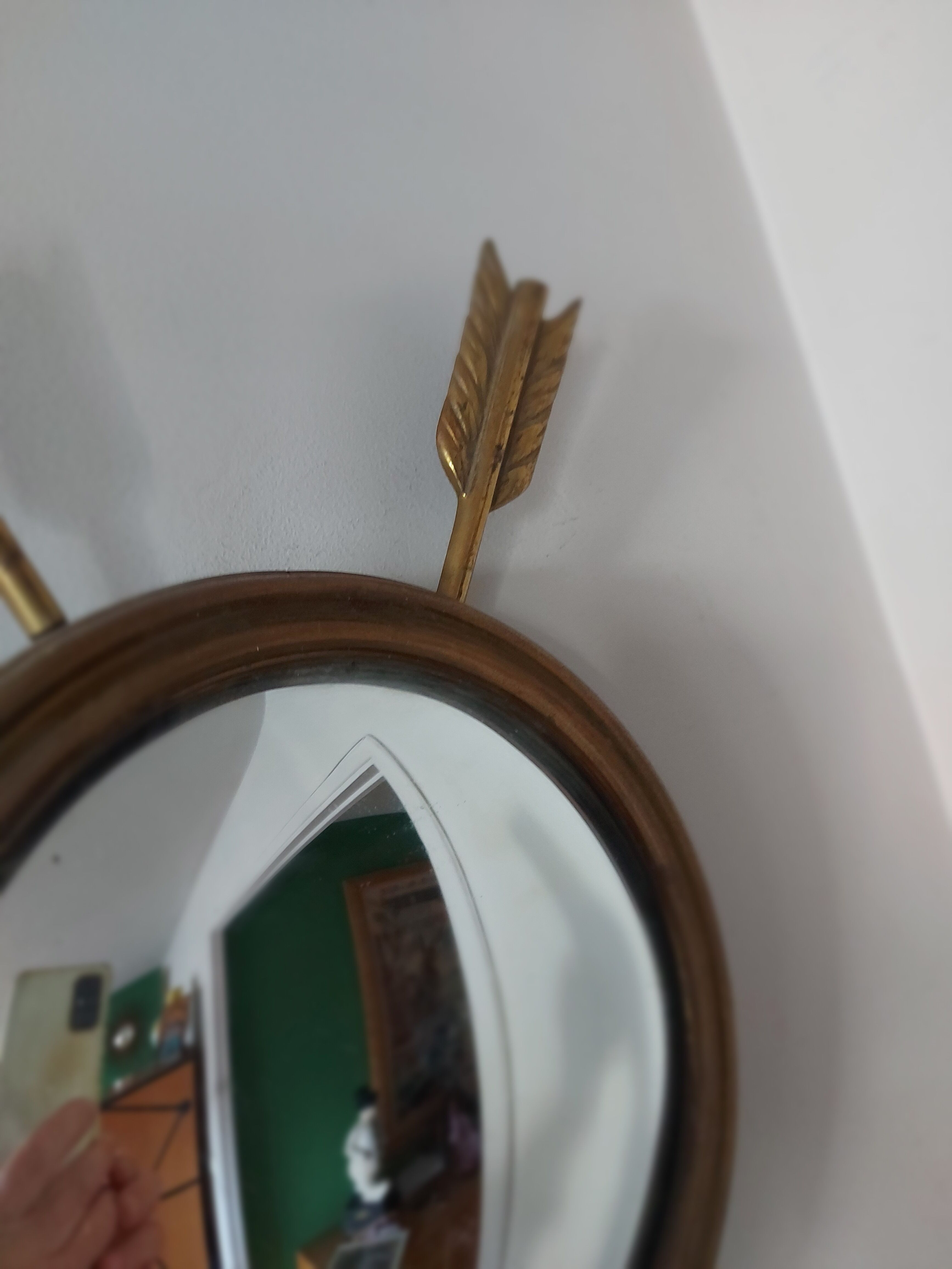Curved brass witch's mirror