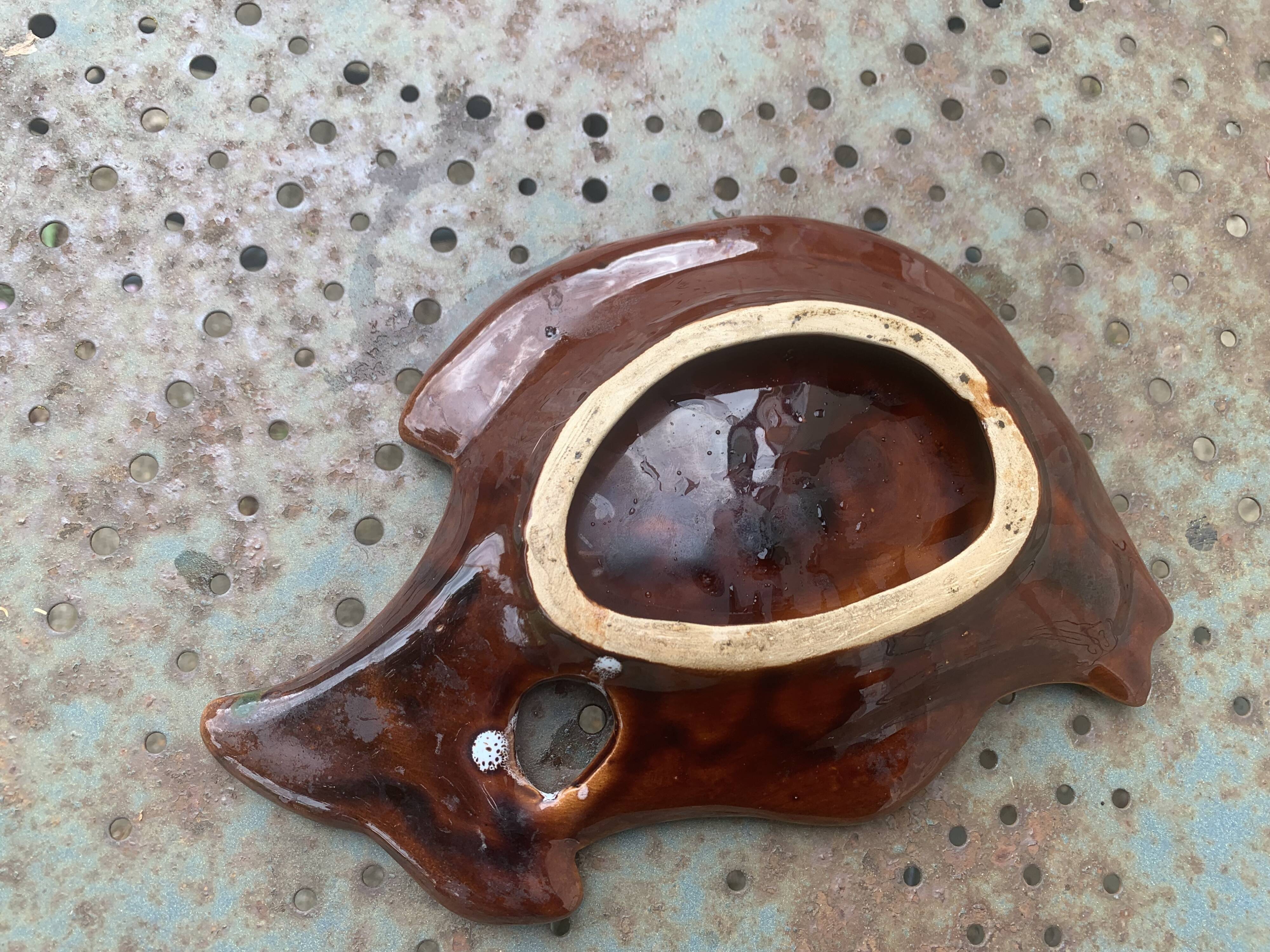 Empty pocket in glazed ceramic slip in the shape of vintage fish