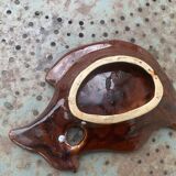 Empty pocket in glazed ceramic slip in the shape of vintage fish