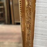 Miroir de style Louis XV en bois et stuc doré XX siècle