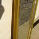 Vertical mirror, gold frame with beading.