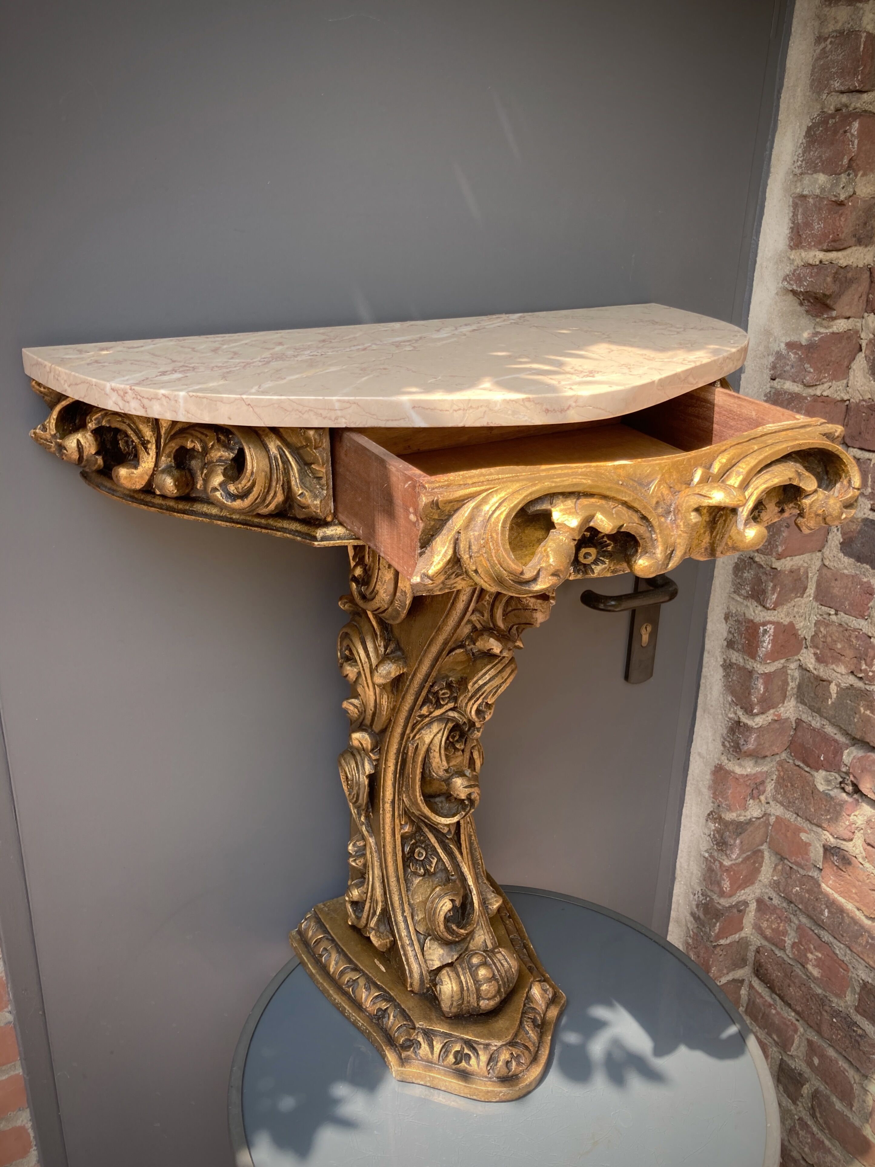 Carved wooden and marble console