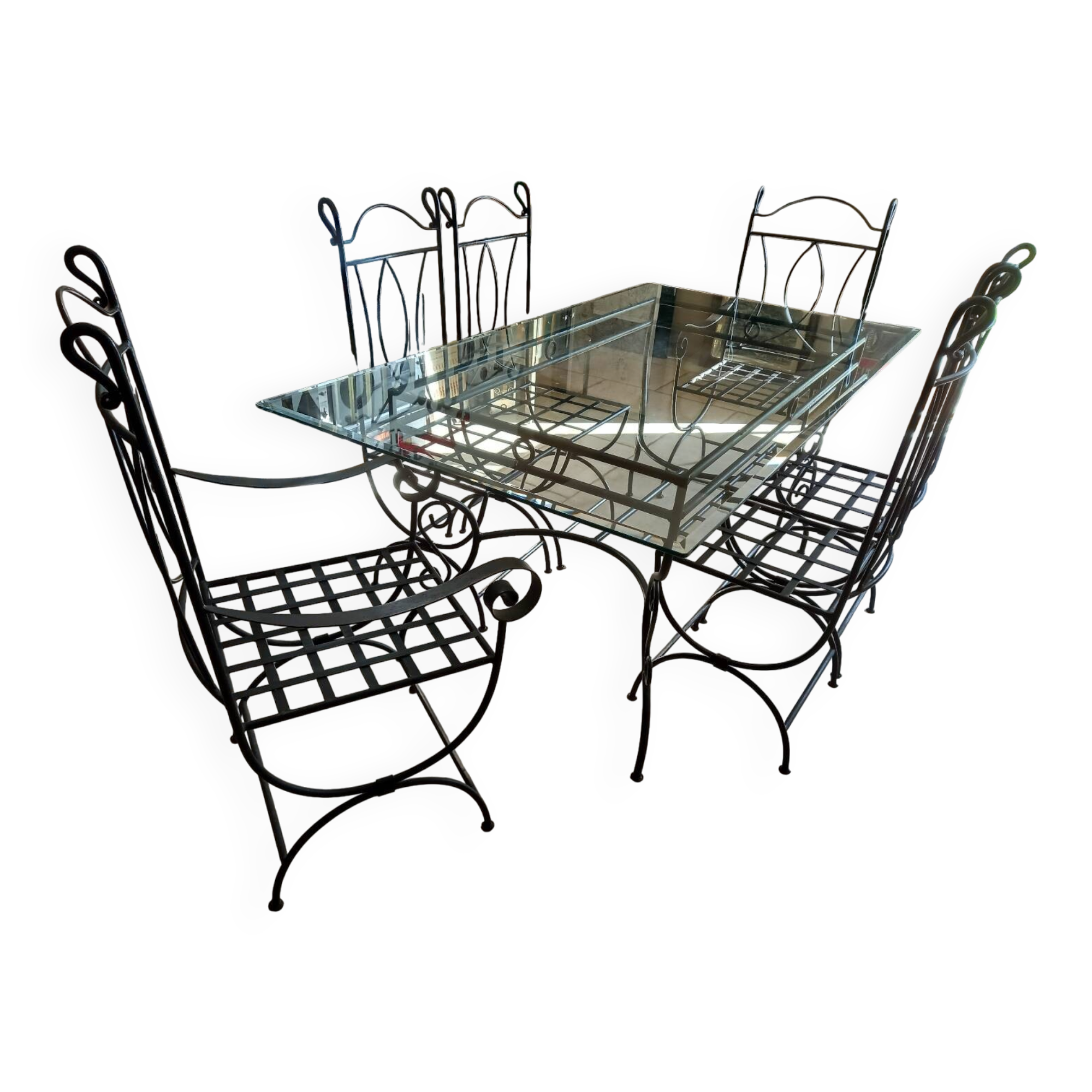 Glass table and wrought iron chairs
