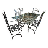 Glass table and wrought iron chairs