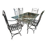 Glass table and wrought iron chairs