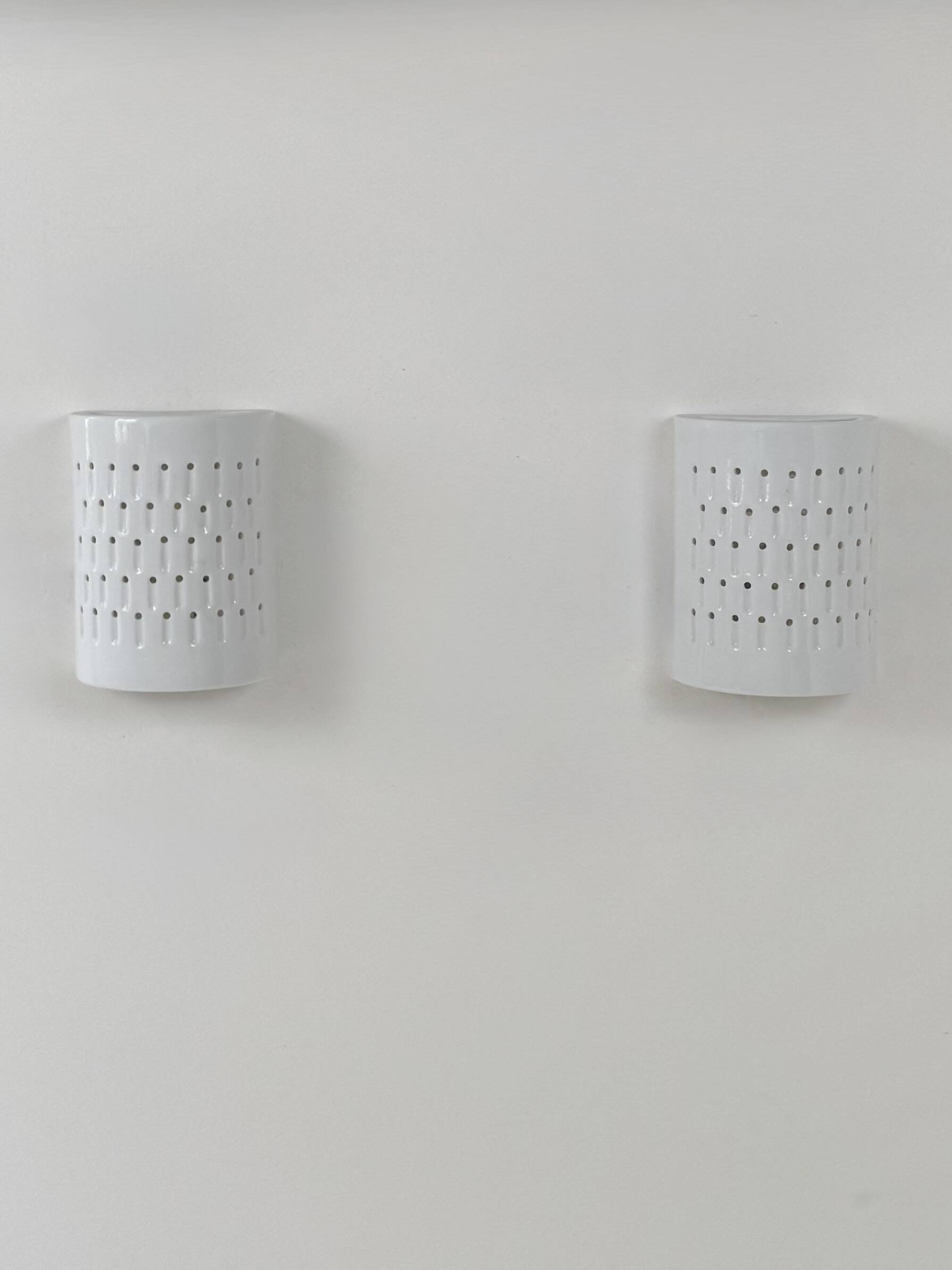 Pair of vintage wall lights in white porcelain, France, 1980.