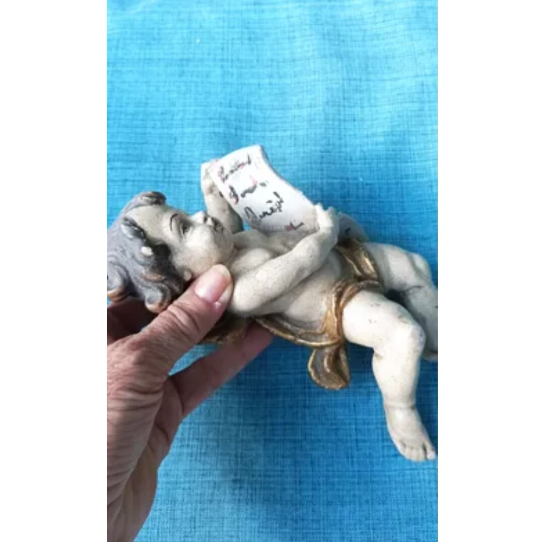 Golden white wooden cherub