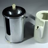 Art Deco porcelain coffee pot by SUS Bavaria with a metal warming hood by WMF, comes from the 1920s