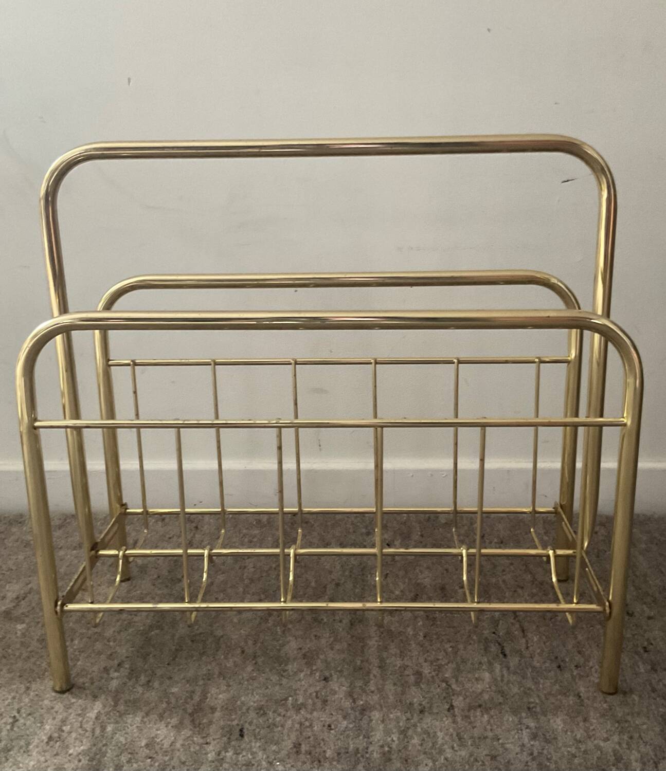 Vintage magazine holder in gold metal