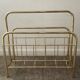 Vintage magazine holder in gold metal