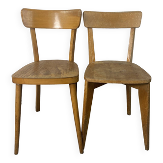 2 mismatched bistro chairs