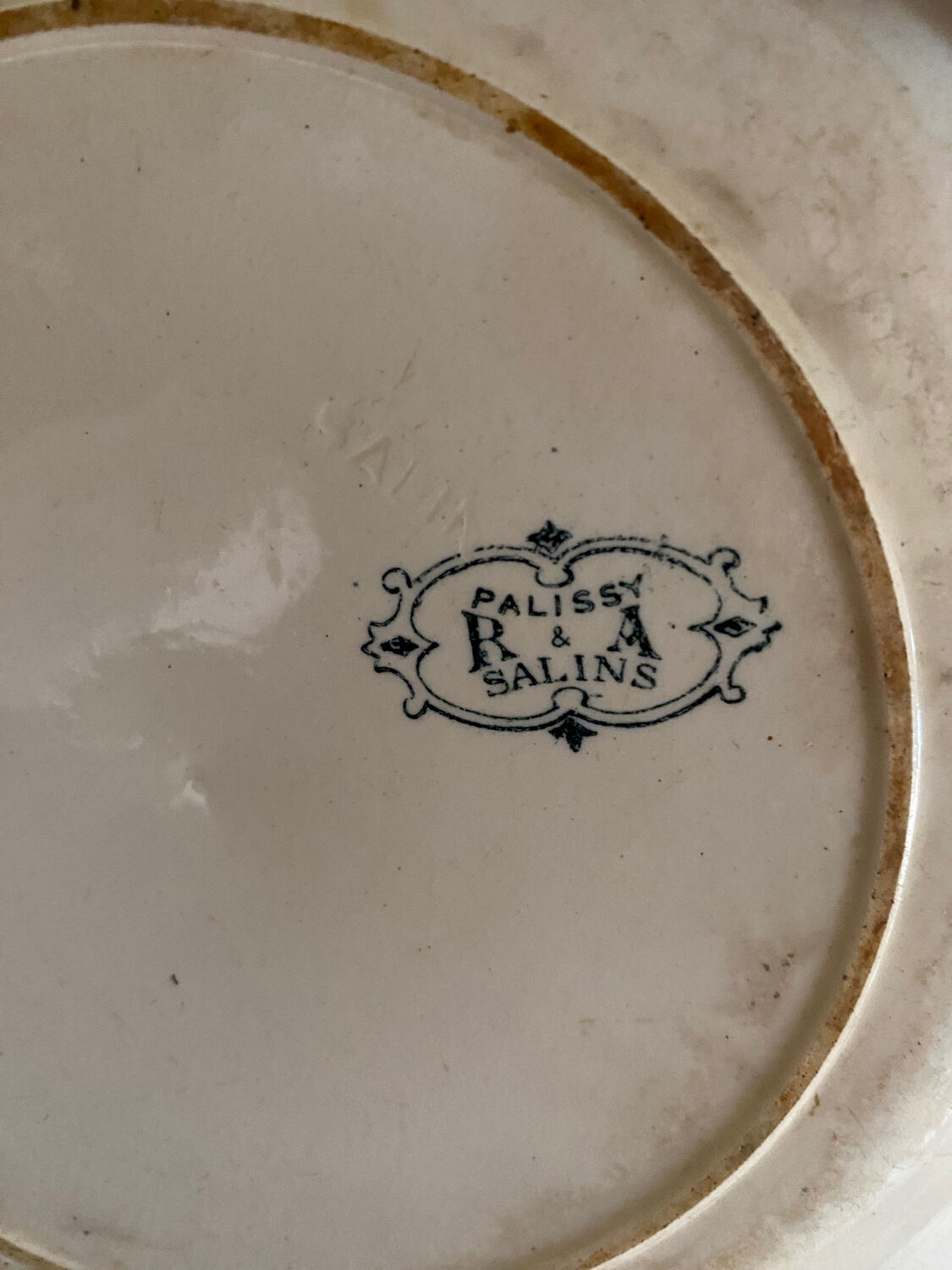 3 mismatched iron earth flat plates in green.