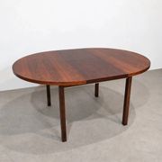 Extendable round rosewood dining table