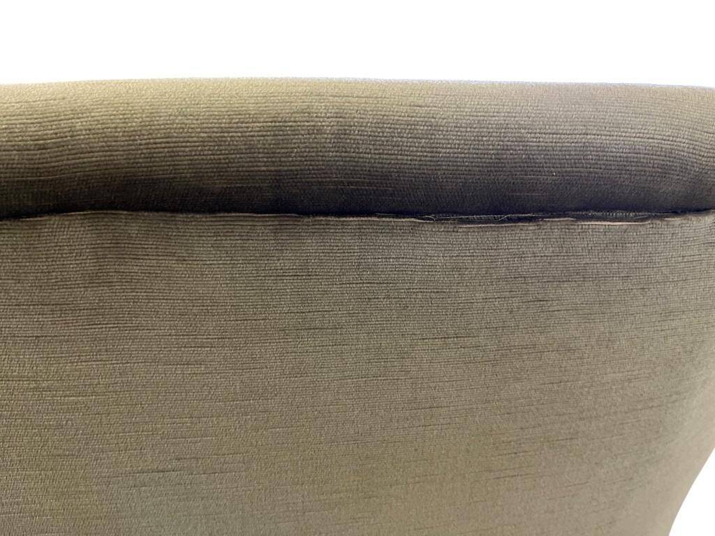 Vintage green two-seater sofa with fringes