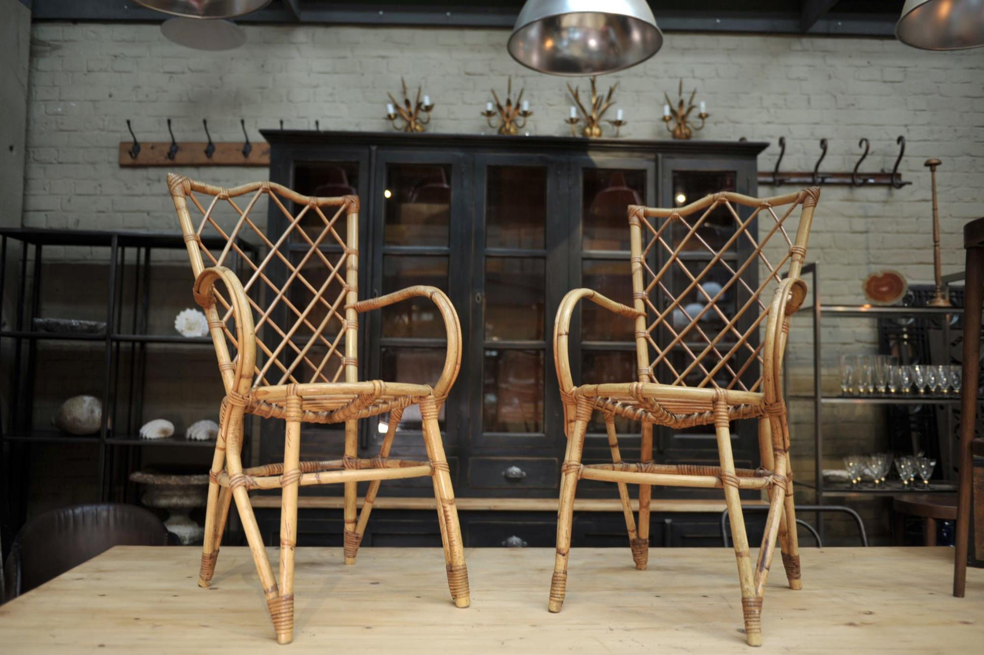 Pair of chairs in rattan 1960 by Louis Sognot