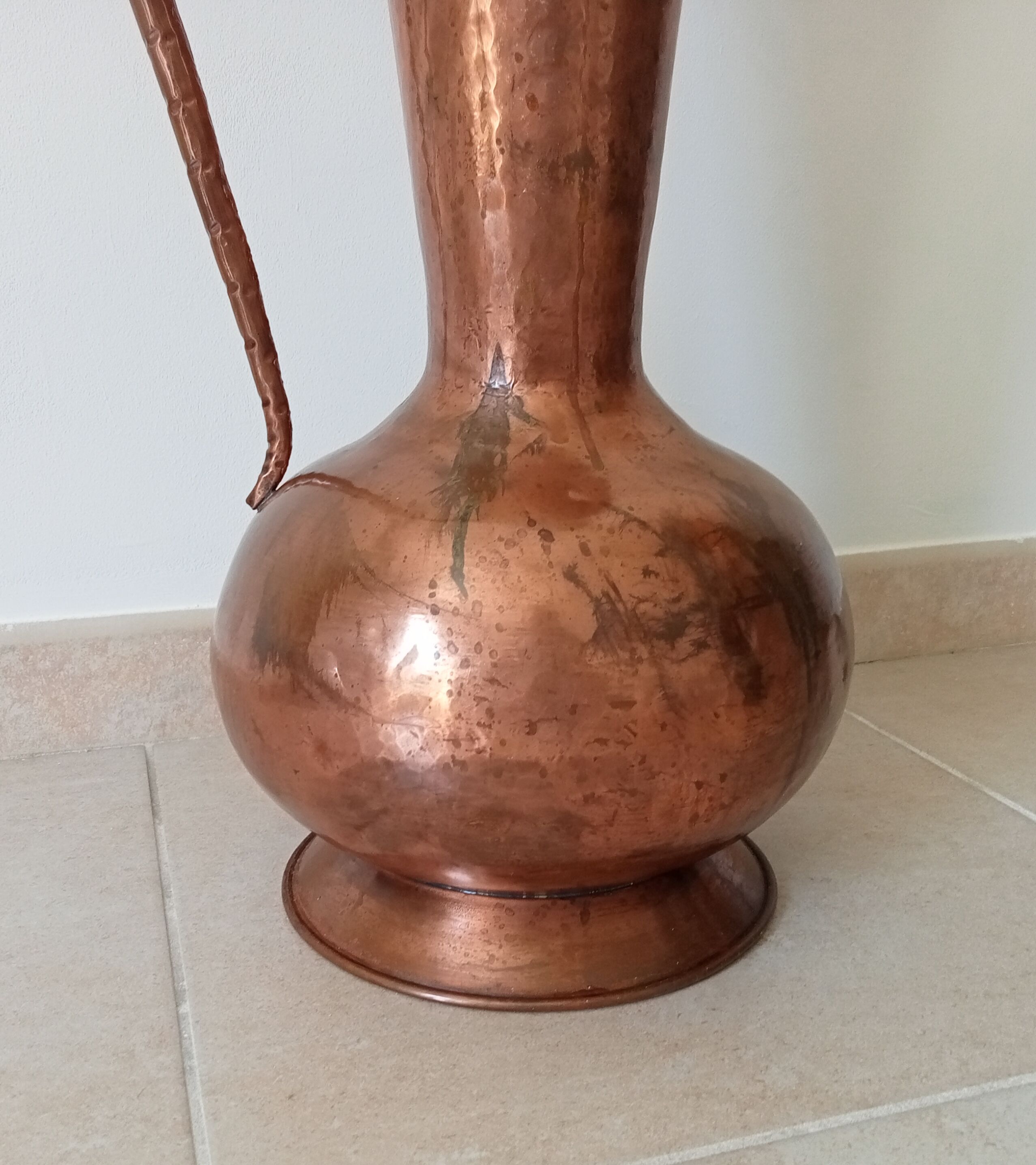 Old italian amphora vase in hammered copper