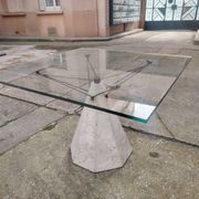 1980s table with a marble and steel base and a square glass top.