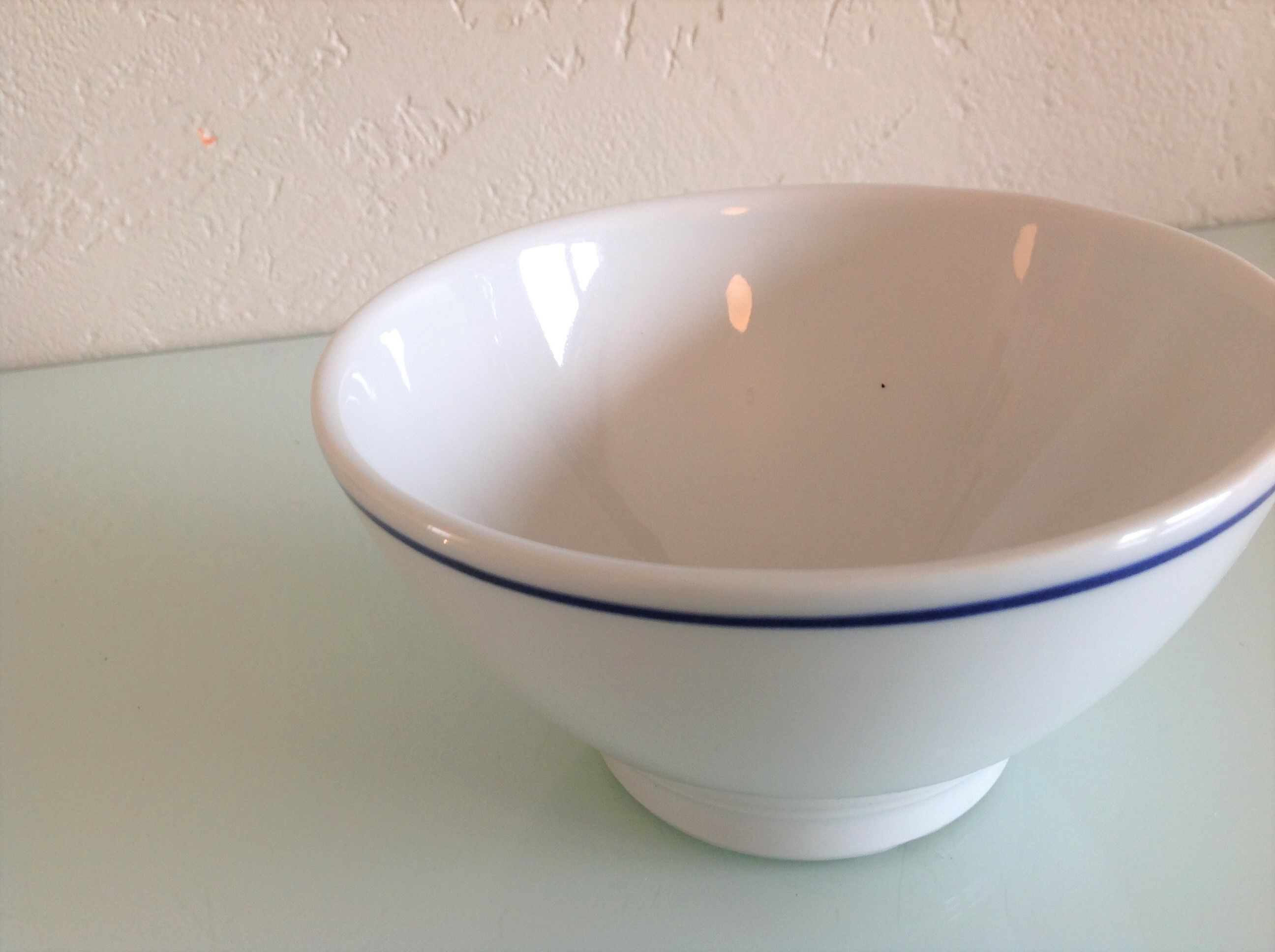White bowl with blue border of the faienceries of Sarreguemines