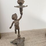 Pewter gray cherub candle holder.