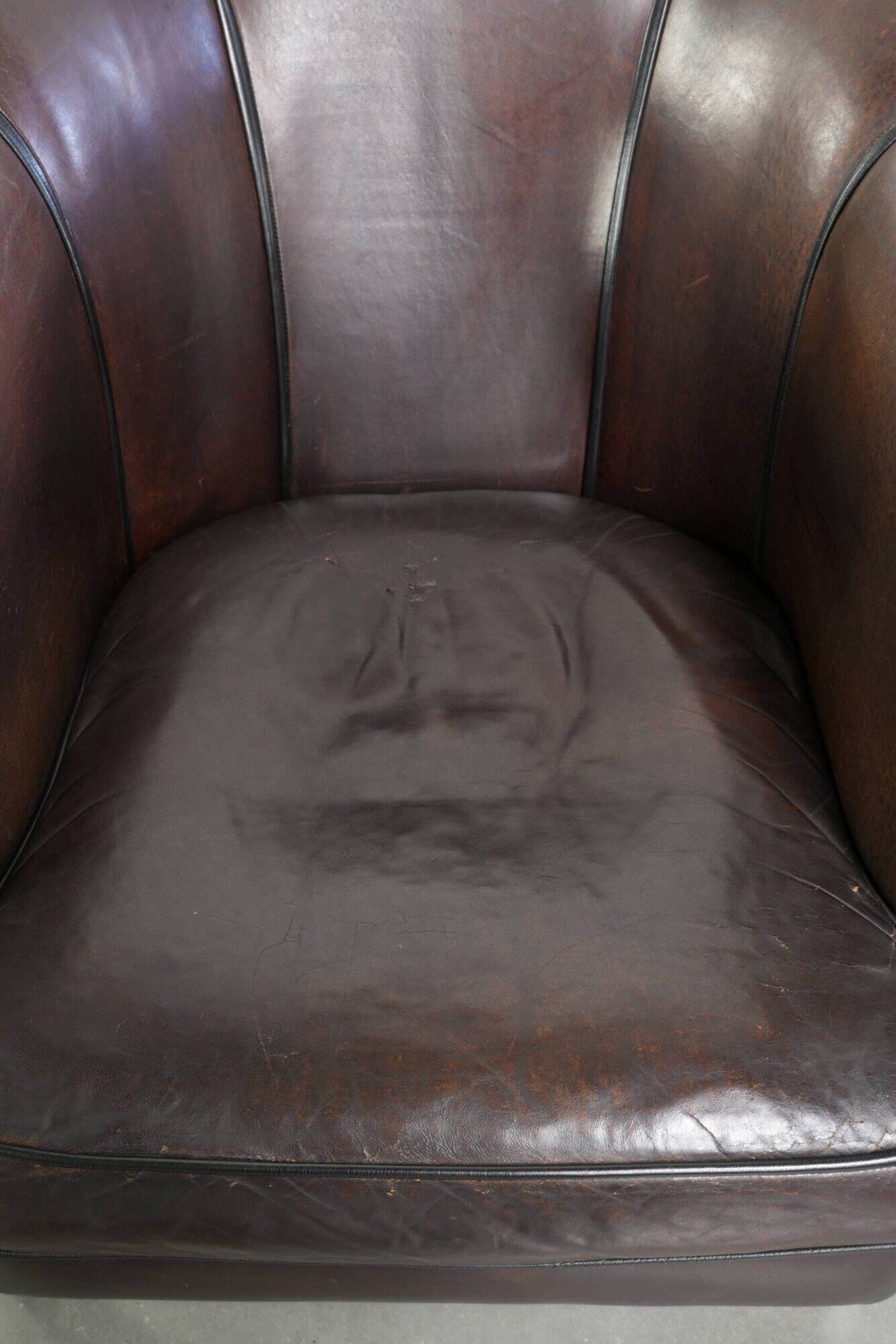 Set of a sheepskin sofa together with its matching club armchair